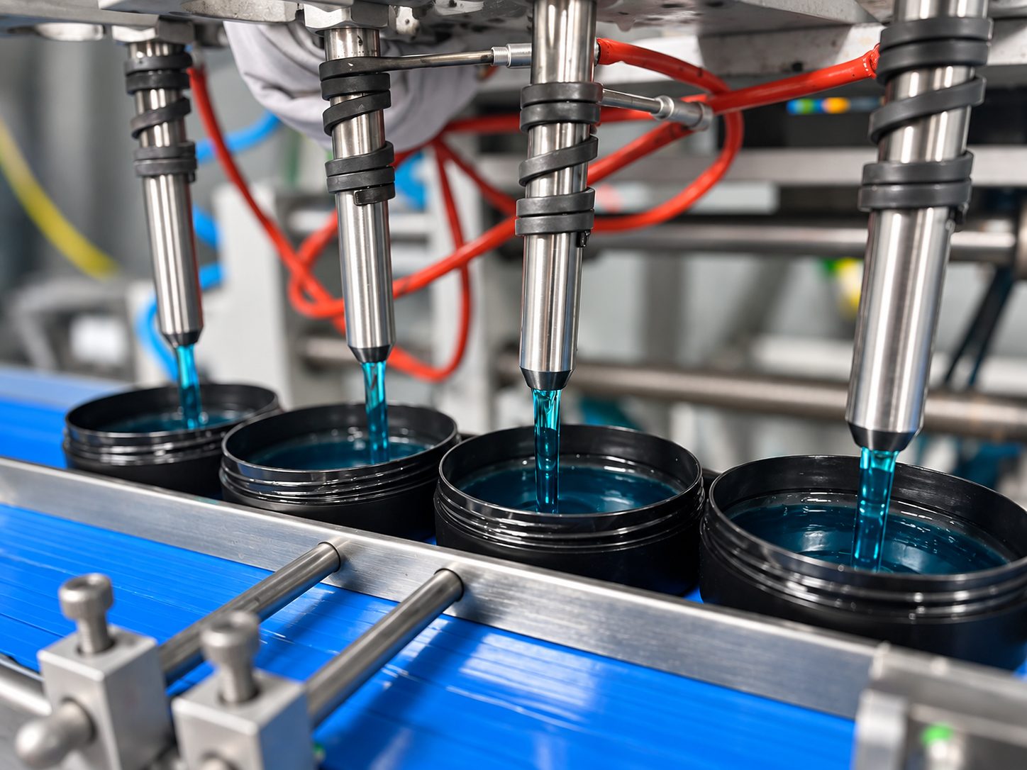 Multi-nozzle filling line dosing hair gel into jars — cosmetic contract manufacturing at Dora Kozmetik, Istanbul
