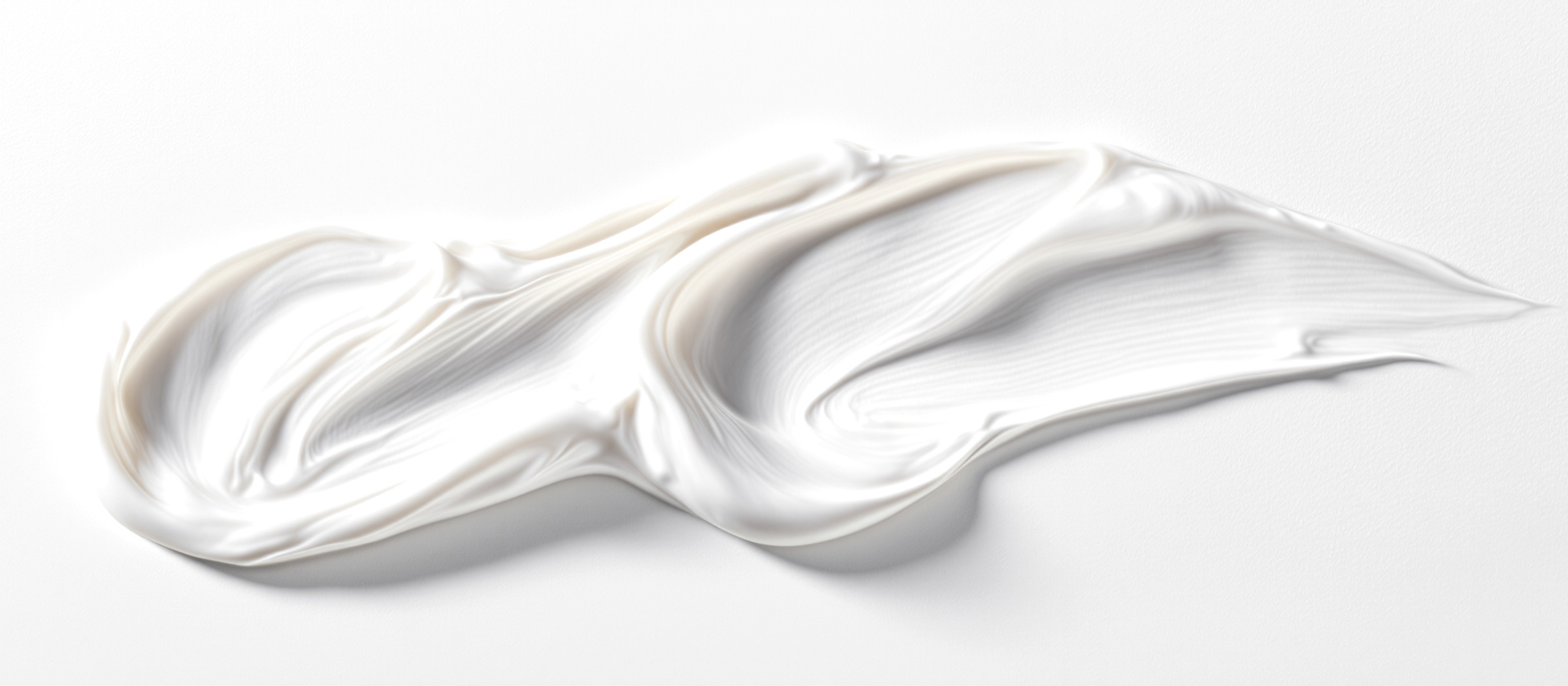 Macro texture of a white face cream — private label skin care manufacturing at Dora Kozmetik